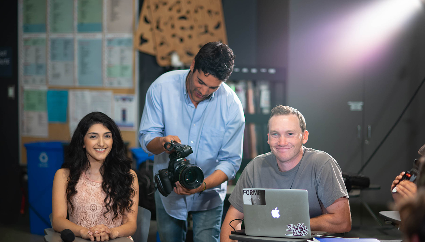 SBCC students with cameras in a classroom.